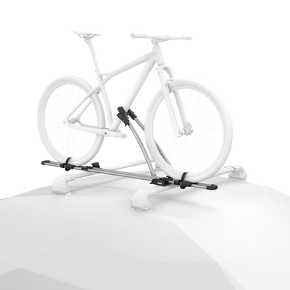 Ghosted illustration of a bicycle secured upright to an aluminum Thule FreeRide mounted on a vehicle roof.